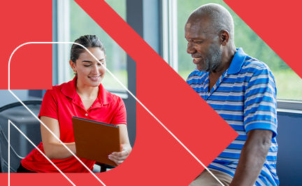 ACE Behavior Change Specialist reviewing SMART goals with a client on a clipboard